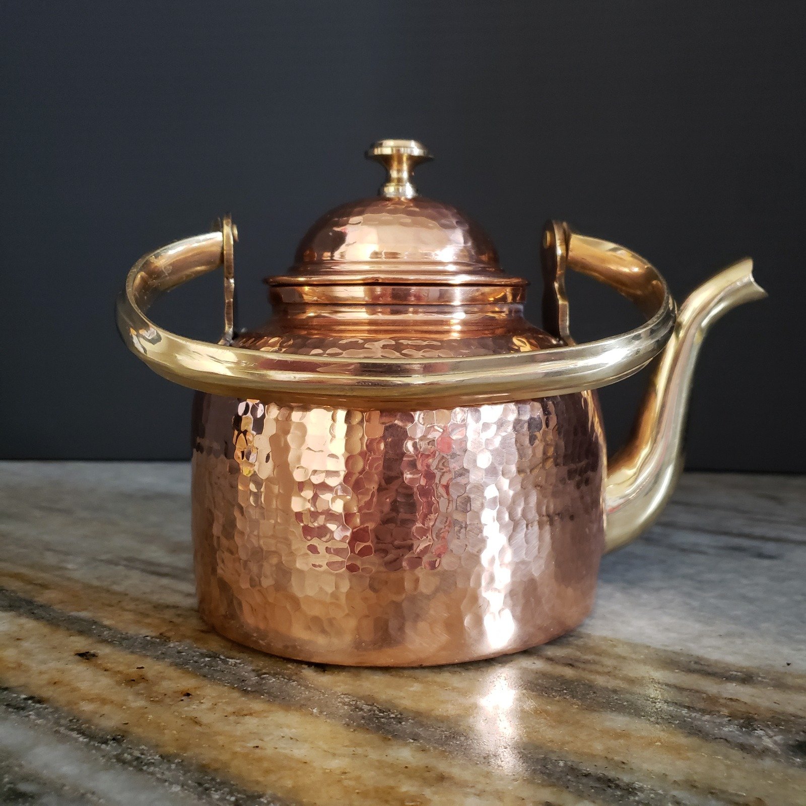 Handmade hammered copper kettle with brass handle
