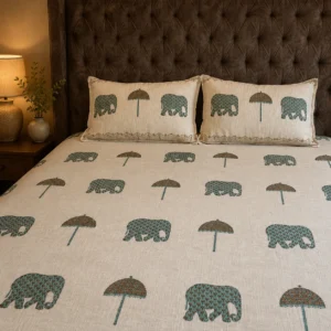 White linen bedsheet with hand block printed elephant and umbrella motifs